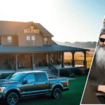 A view of the do Phil and Kay really live in that house showing the rustic Louisiana home with a framed portrait of Phil and Kay Robertson in the foreground.