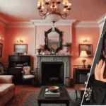 Image showing the gypsy rose pink house with its bright pink exterior in the background and a framed portrait of the owner displayed at the front.