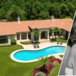 Image showing the Tina Louise House with the house in the background and the owner’s portrait in a frame placed at the front.