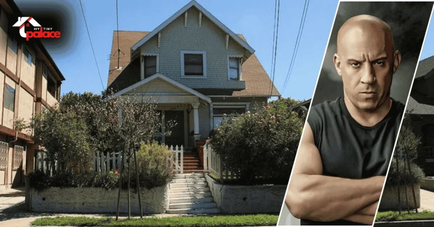 A view of the Toretto House Los Angeles showing the classic white home in Echo Park with a framed portrait of Dominic Toretto in the foreground.