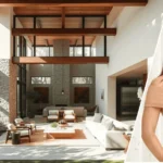 Image showing the kelly dodd house with the modern home in the background and a framed portrait of Kelly Dodd displayed at the front.