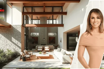 Image showing the kelly dodd house with the modern home in the background and a framed portrait of Kelly Dodd displayed at the front.