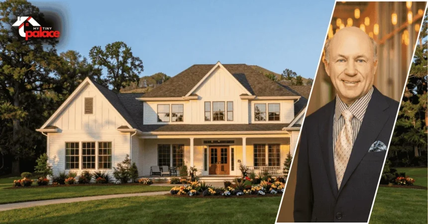 An exterior view of the dan cathy house with the residence in the background and a framed portrait of Dan Cathy displayed at the front