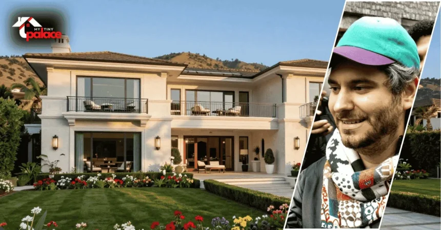 The ethan kleins house shown from the outside with the home in the background and a framed portrait of Ethan Klein placed at the front.