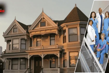 An exterior view of the grey's anatomy house seattle with the house in the background and a framed portrait of the main character displayed at the front