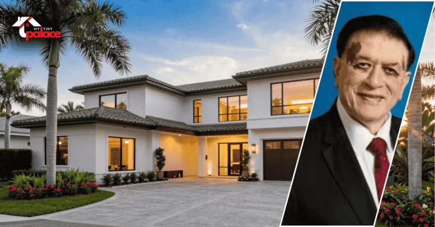 Image showing the kiran patel house in tampa with the residence in the background and a framed portrait of Kiran Patel displayed at the front