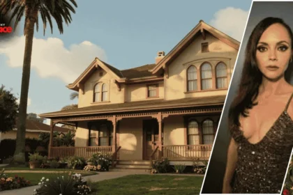 The christina ricci old house is visible in the background with its white stucco walls and red tiled roof while a framed portrait of Christina Ricci stands in the foreground.