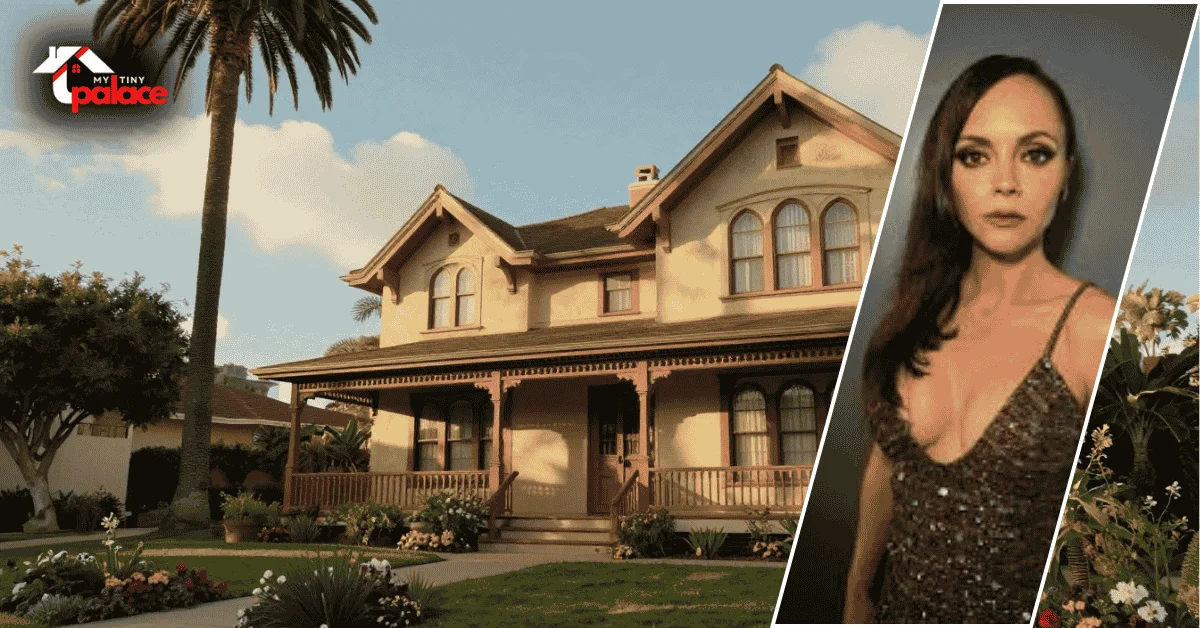 The christina ricci old house is visible in the background with its white stucco walls and red tiled roof while a framed portrait of Christina Ricci stands in the foreground.