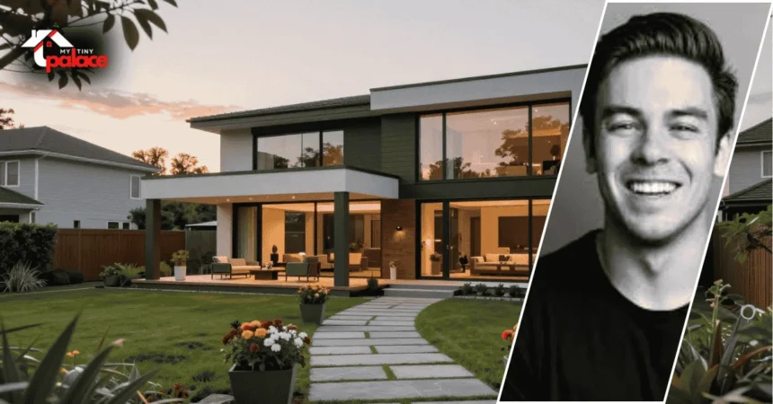 A wide shot of the modern Cody Ko house exterior featuring large glass windows and clean lines, with a gold-framed portrait of Cody Ko positioned clearly in the foreground.