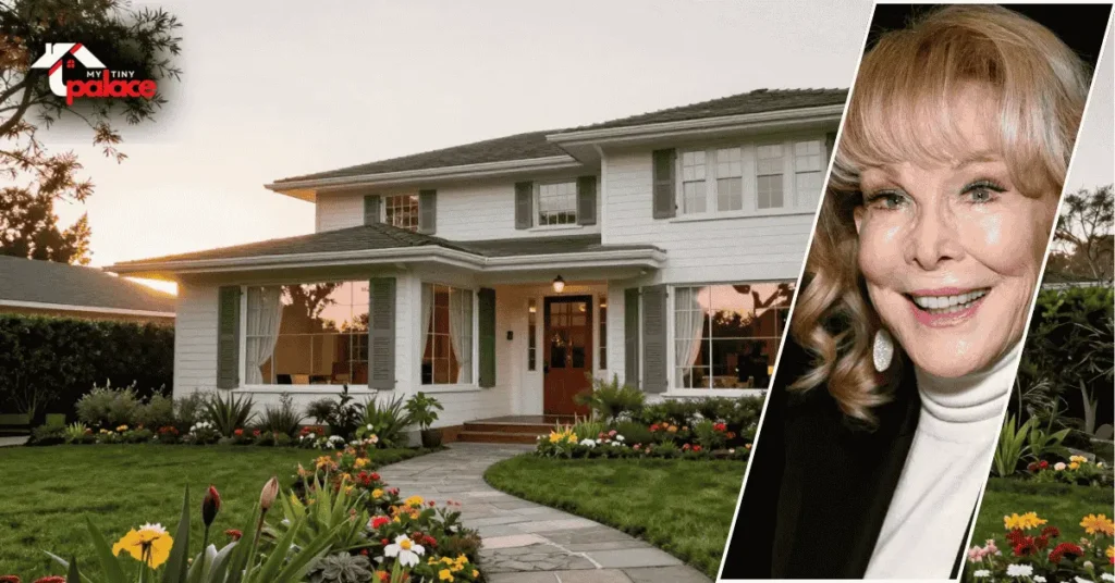 A photograph of the Barbara Eden house showing the exterior architecture in the background with a framed portrait of Barbara Eden positioned in the foreground.